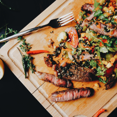 Air Fryer Garlic Butter Steak Salad with tender steak, fresh greens, and colorful vegetables.