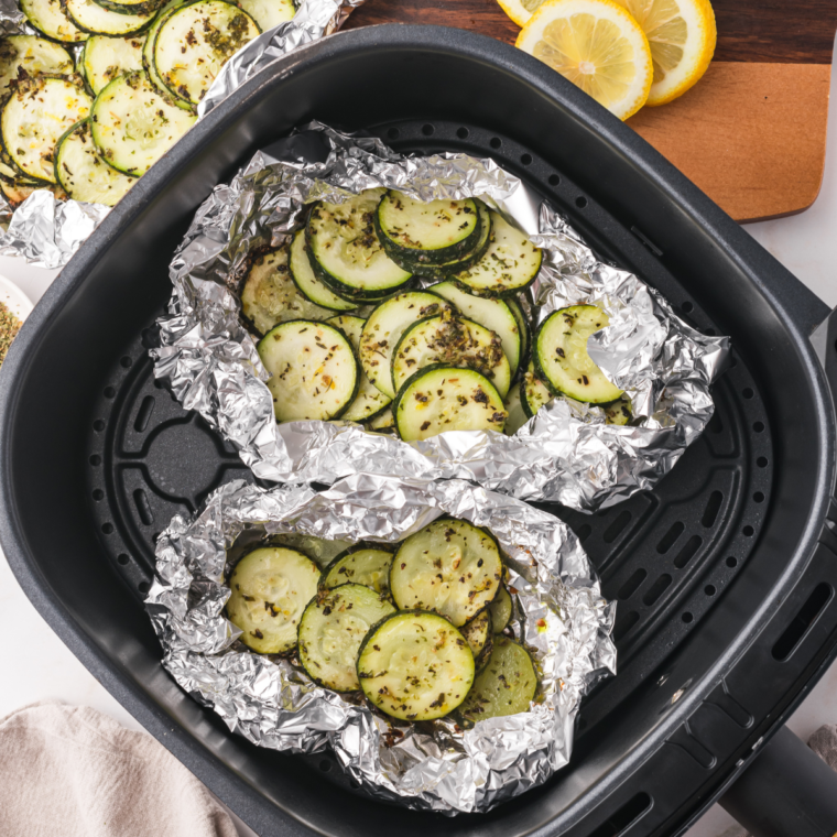 Air Fryer Zucchini Foil Packets filled with seasoned zucchini slices ready to cook.