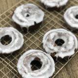 Freshly made copycat Dunkin’ Donuts chocolate glazed donuts with shiny glaze.