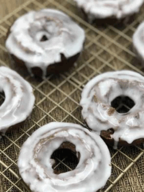 Freshly made copycat Dunkin’ Donuts chocolate glazed donuts with shiny glaze.