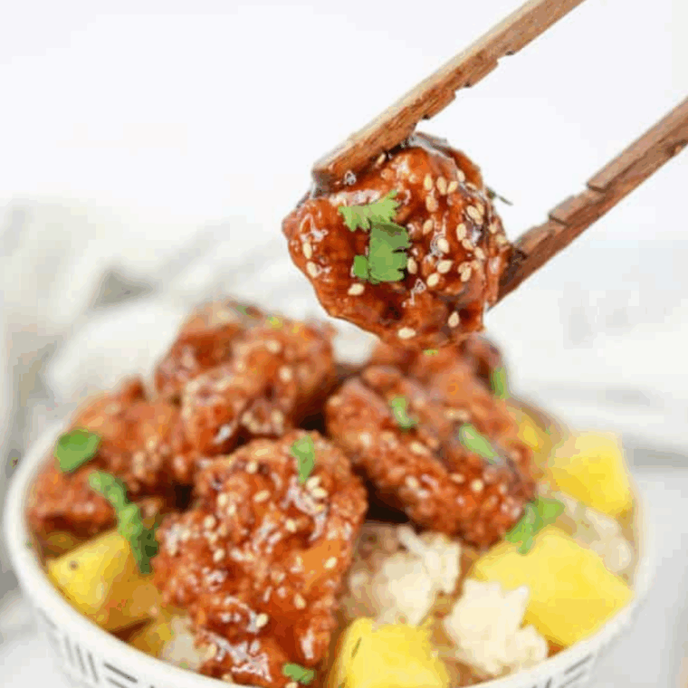 PF Chang's Teriyaki Chicken served with rice and vegetables on a white plate.