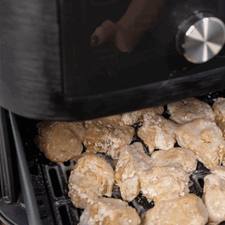 Place the coated chicken into the air fryer basket.