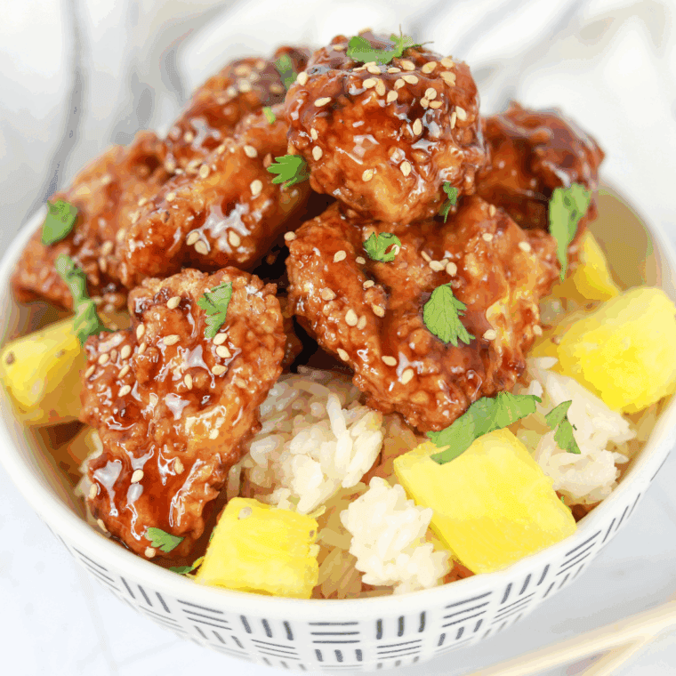 PF Chang’s Teriyaki Chicken garnished with sesame seeds and green onions, served with rice.