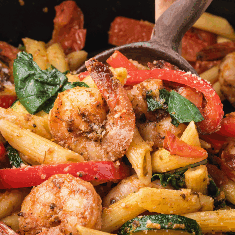 Grilled Texas Roadhouse-style shrimp skewers garnished with lemon wedges on a plate.