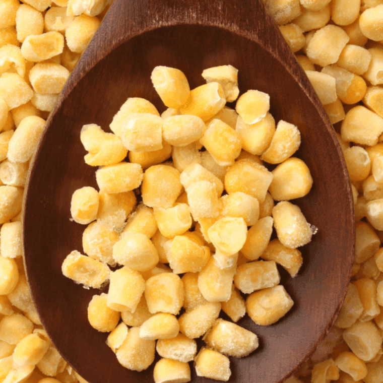 Ingredients needed for Air Fryer Frozen Corn Kernels on kitchen table.