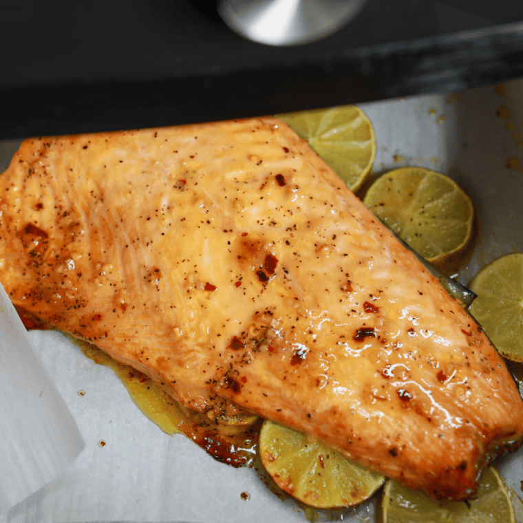 Glazed salmon fillets in a single layer in the air fryer basket