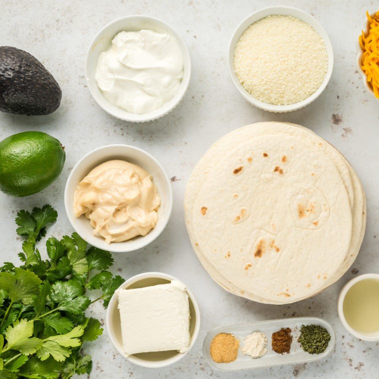 Ingredients needed for Air Fried Refried Bean and Veggie Flautas on table.