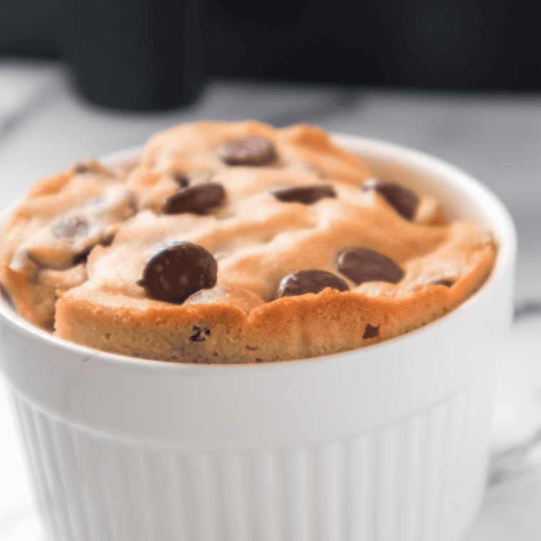 Single-serve air fryer cookie in a mug served warm and ready to eat in 10 minutes.