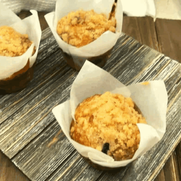 Golden, fluffy air fryer wild blueberry muffins with sweet crumb topping