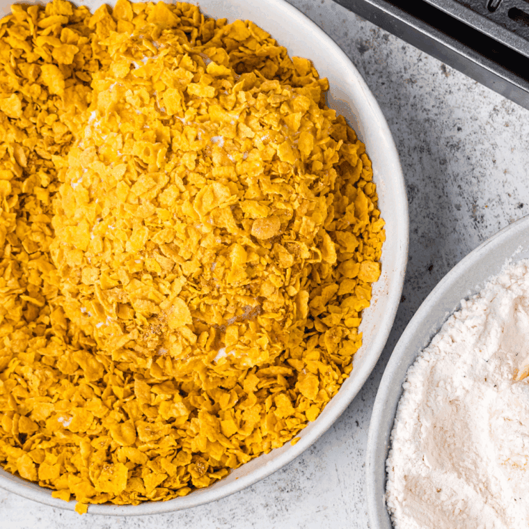 Coat the chicken tenders in a bowl of cornflakes.