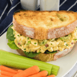 Creamy homemade egg salad made with air fryer eggs, served on toasted bread with lettuce.