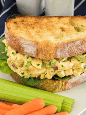 Creamy homemade egg salad made with air fryer eggs, served on toasted bread with lettuce.