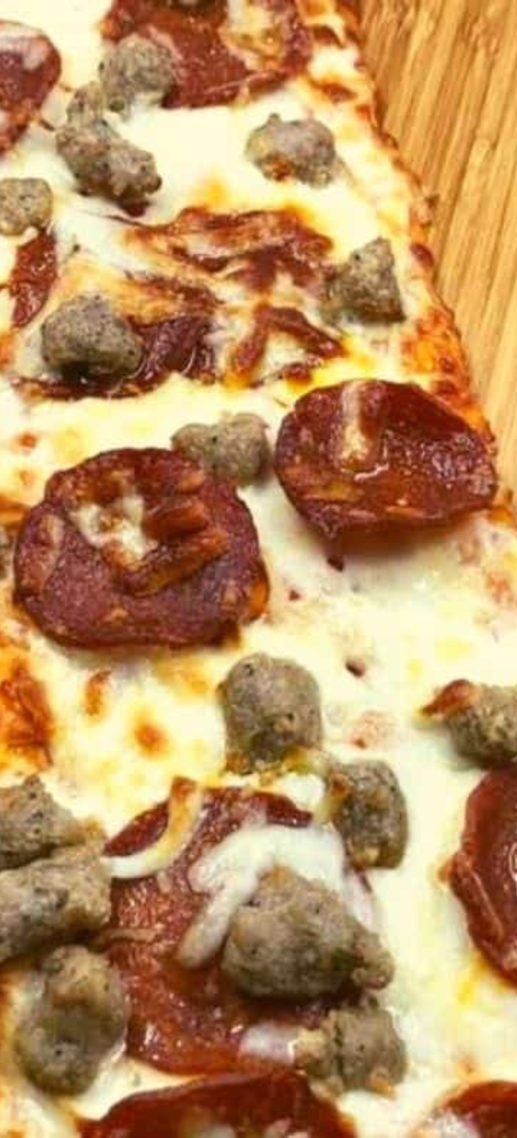 Air Fryer Pepperoni and Sausage Flatbread Pizza with crispy crust, savory toppings, and melted mozzarella cheese, perfect for a quick and delicious meal.