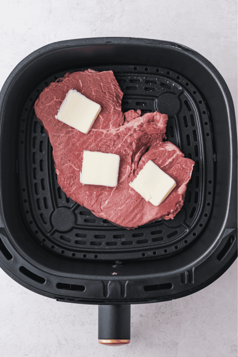 Letting juicy steaks rest for 5 minutes to redistribute juices, ensuring a tender air fryer sirloin steak.