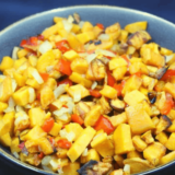 Air fryer sweet potato hash cooked with onions and peppers until golden and crisp for quick healthy breakfast bowl or side