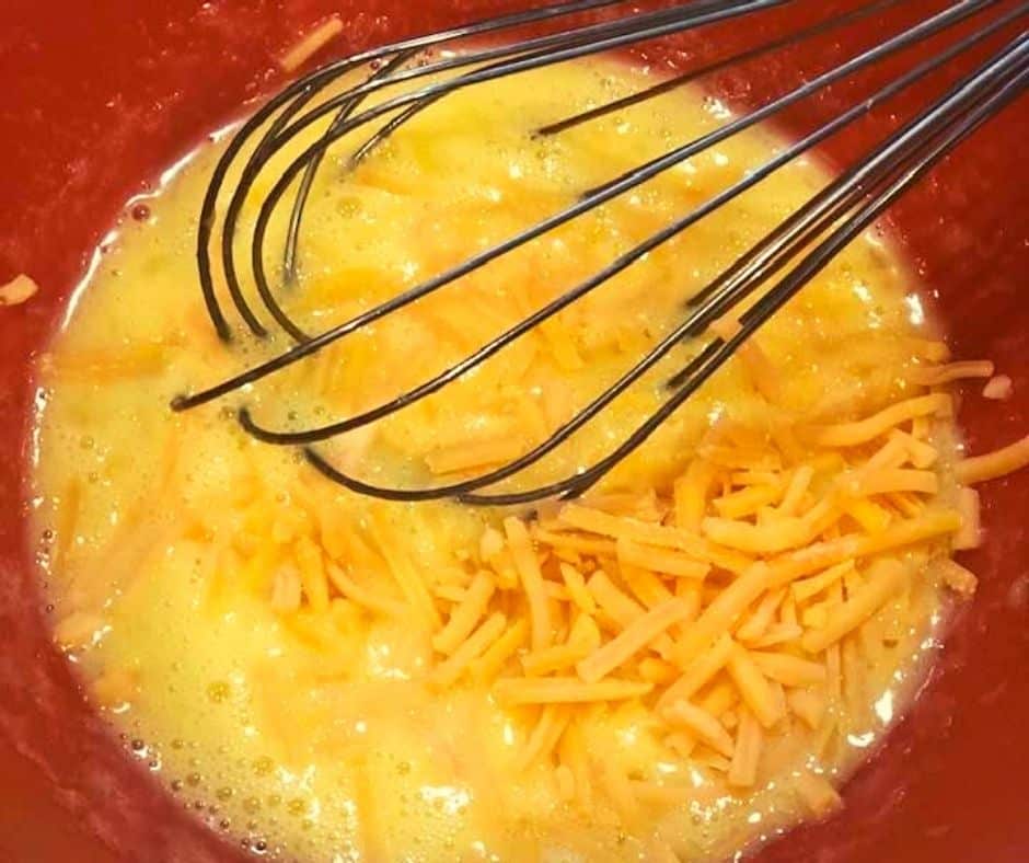 Eggs and Cheese Being Whisked