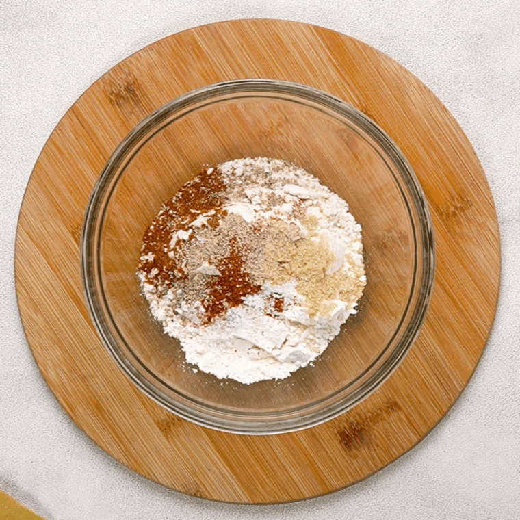 In a small mixing bowl, add all of the breading ingredients, mix well to combine.