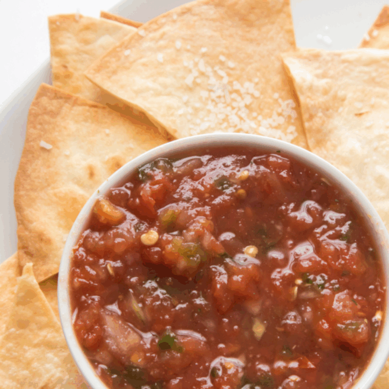 Copycat Chili’s Salsa made with fresh tomatoes, onions, and spices, ready to serve as a delicious dip or topping.