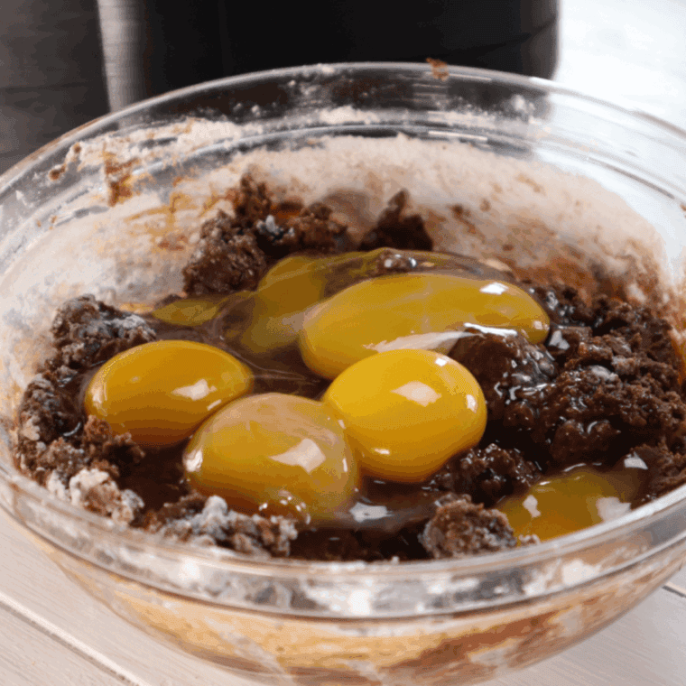 Add the eggs into the mixture, and mix well.