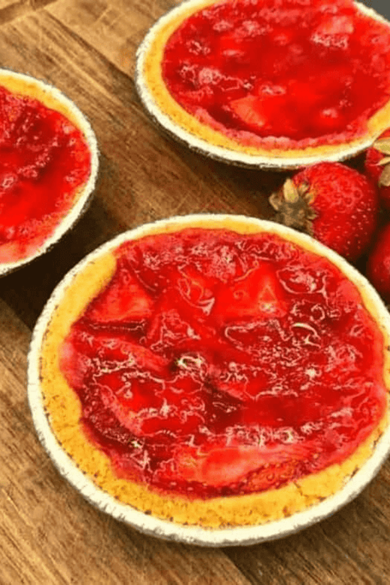 Golden mini strawberry pies with flaky graham cracker crusts and fresh strawberry filling