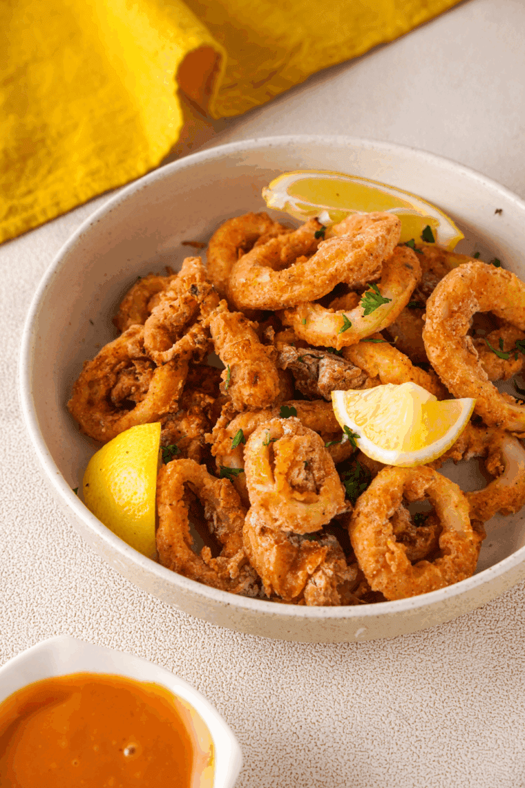 Crispy homemade Carrabba’s Calamari served with lemon wedges and marinara sauce.