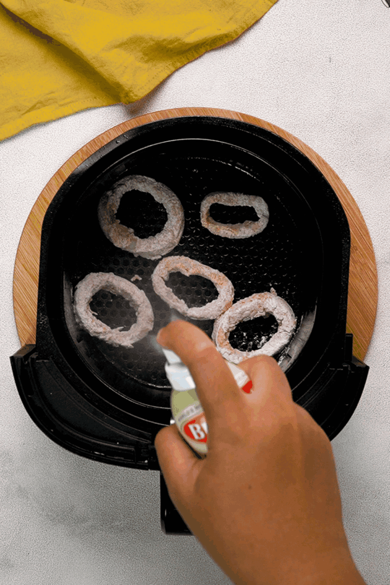 Place the breaded calamari in the air fryer basket.
