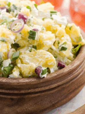 Bowl of creamy Hellmann&rsquo;s Original Potato Salad with tender potato chunks and classic seasonings.