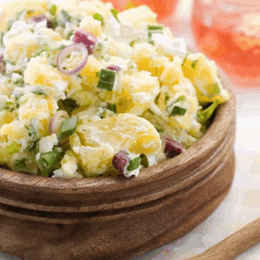 Bowl of creamy Hellmann&rsquo;s Original Potato Salad with tender potato chunks and classic seasonings.