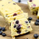 Sliced Instant Pot Blueberry Loaf showing moist crumb and fresh blueberries inside