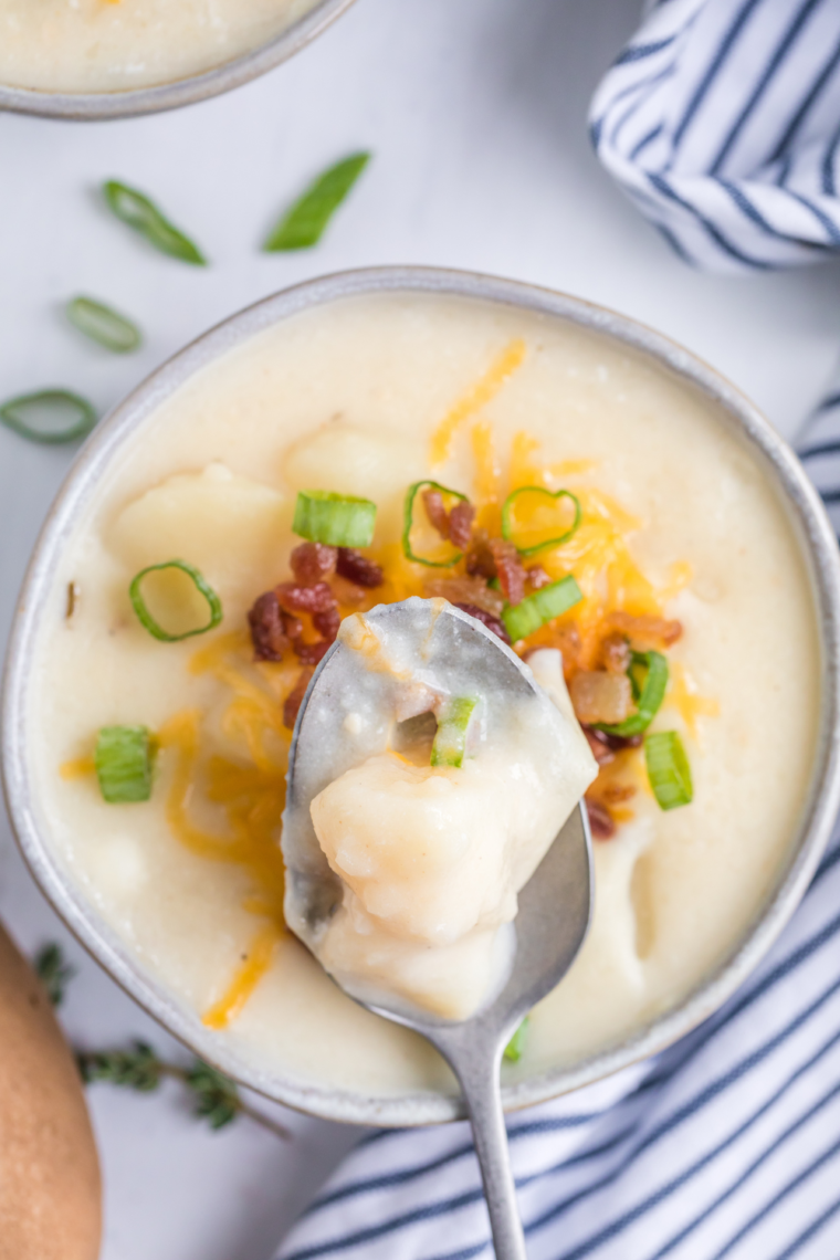 "Close-up of Instant Pot Chili’s Baked Potato Soup in bowls, featuring a hearty and creamy consistency with toppings."