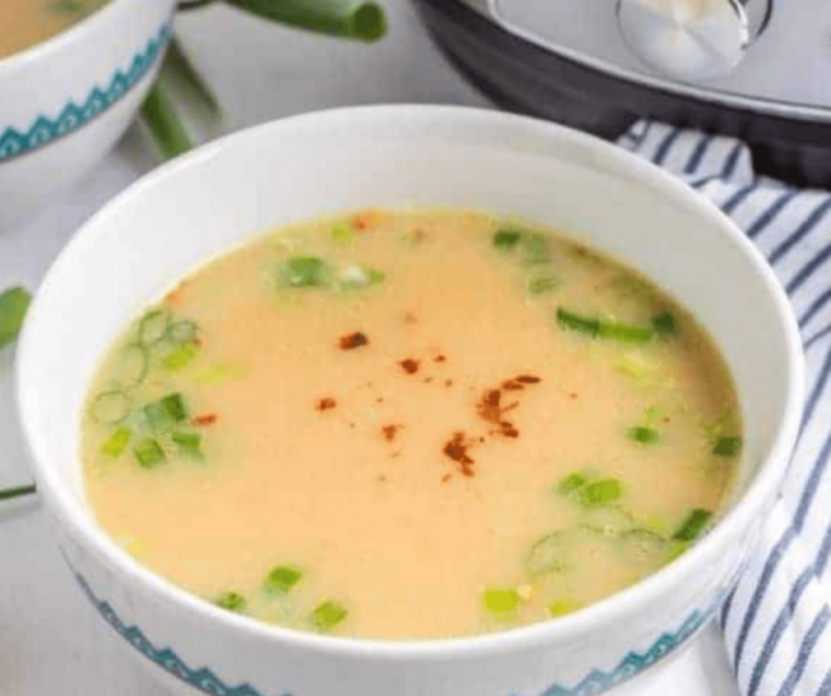 "Finished Instant Pot Chinese Imperial Palace Egg Drop Soup served in bowls, showcasing a smooth, golden broth with silky egg ribbons."