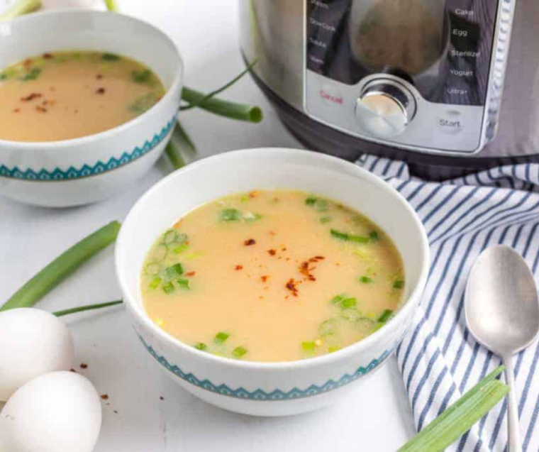 "Serving hot bowls of Instant Pot Chinese Imperial Palace Egg Drop Soup, ready to enjoy."