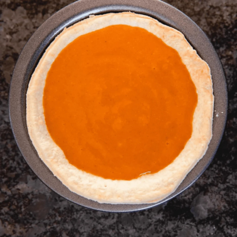 Two ingredients for pumpkin pie bites: a whole pumpkin pie and a can of whipped cream