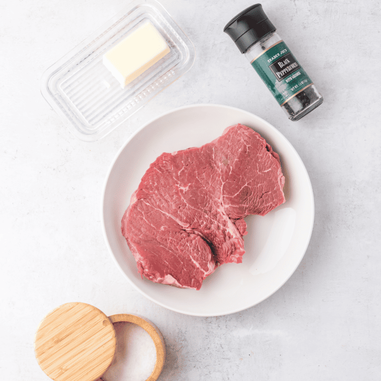 Ingredients needed for Air Fryer Sirloin Steak on kitchen table.