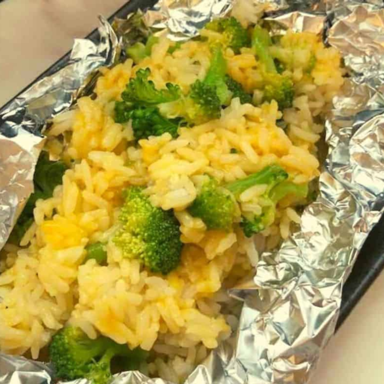 Air fryer cheesy broccoli and rice served in foil.