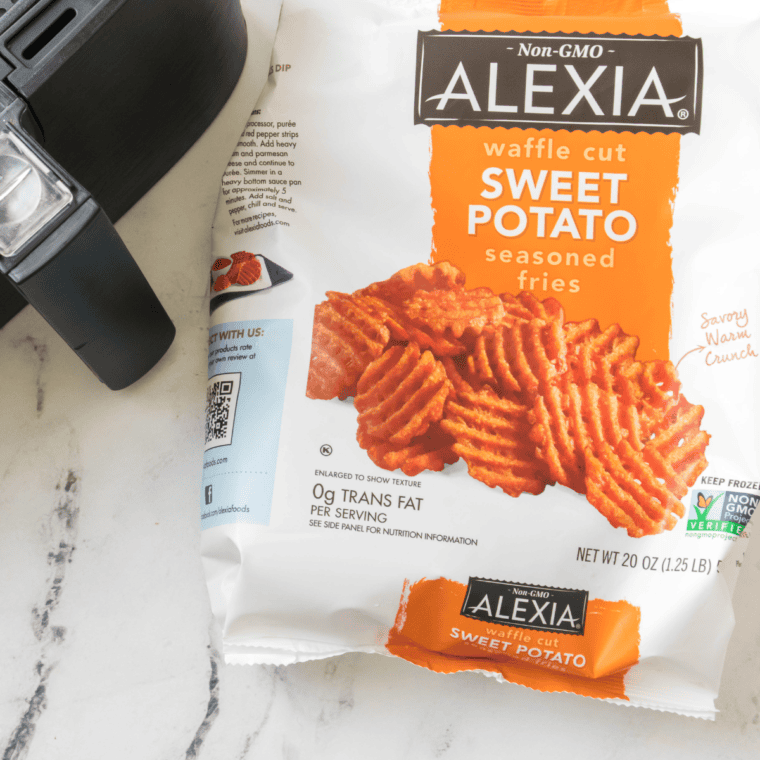 Ingredients needed for Air Fryer Frozen Sweet Potato Fries on kitchen table.