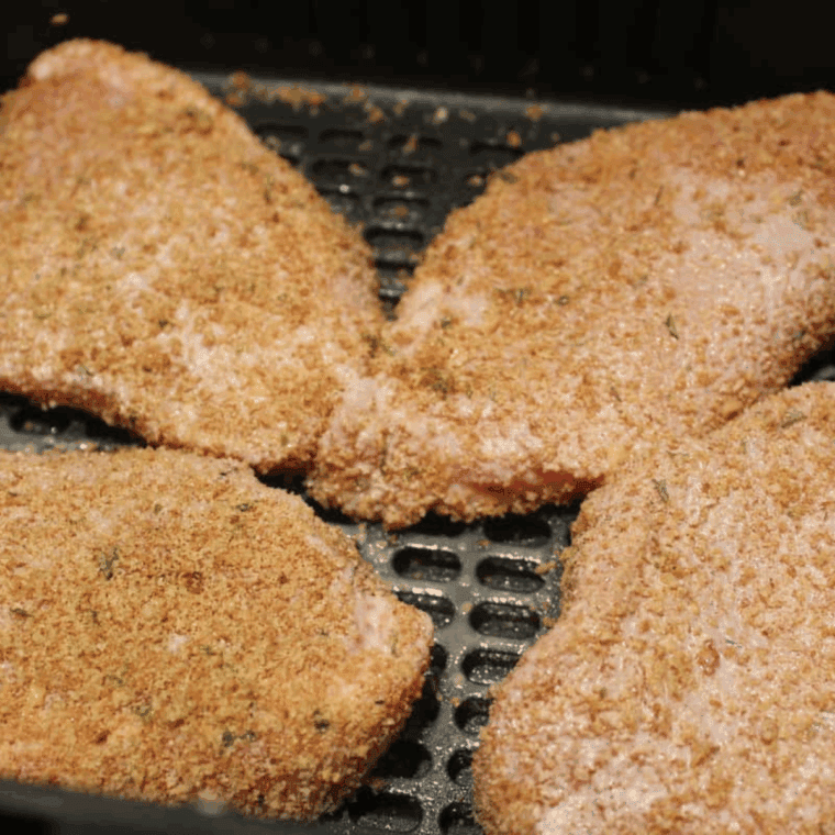 Place coated pork chops in the air fryer basket.