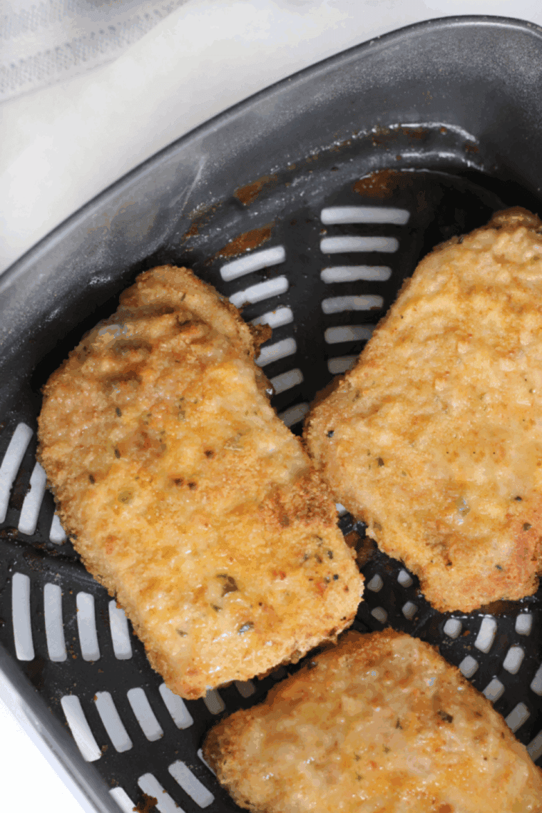 Air Fryer Mexican Pork Chops in air fryer basket.
