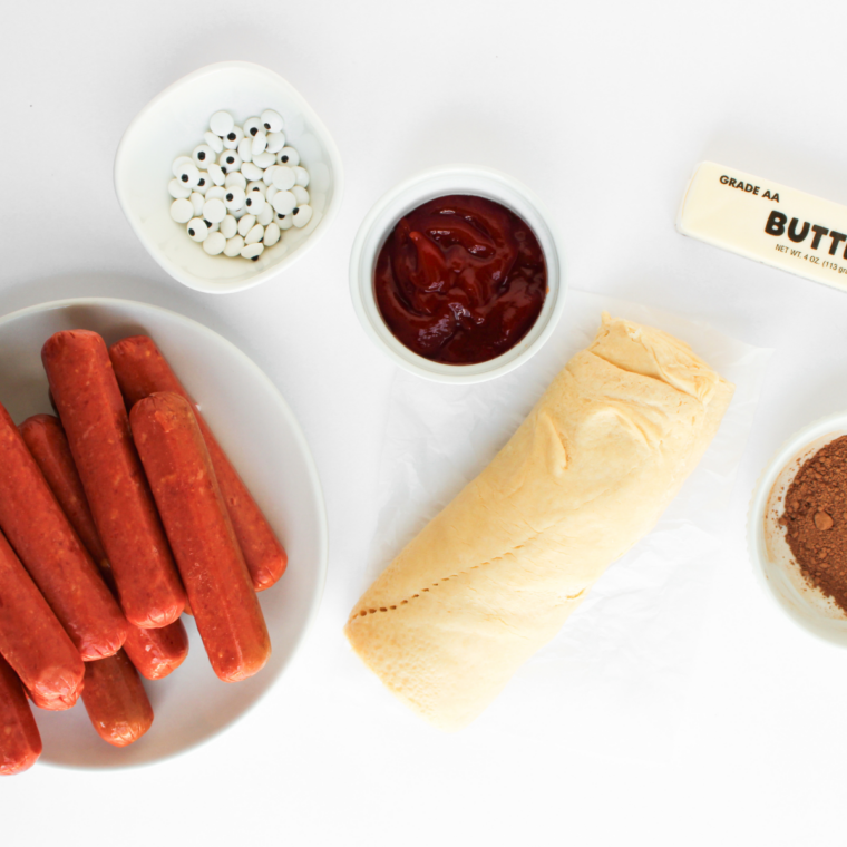 Ingredients needed for Air Fryer Mummy Hot Dogs on kitchen table.