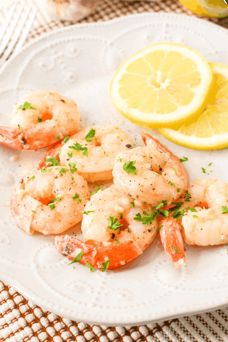 Homemade Carrabba's shrimp scampi with garlic, lemon, and white wine served over pasta.