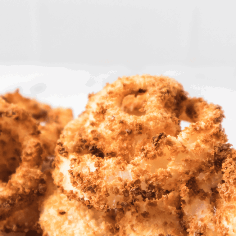 Golden crispy homemade A&W copycat onion rings on a plate”