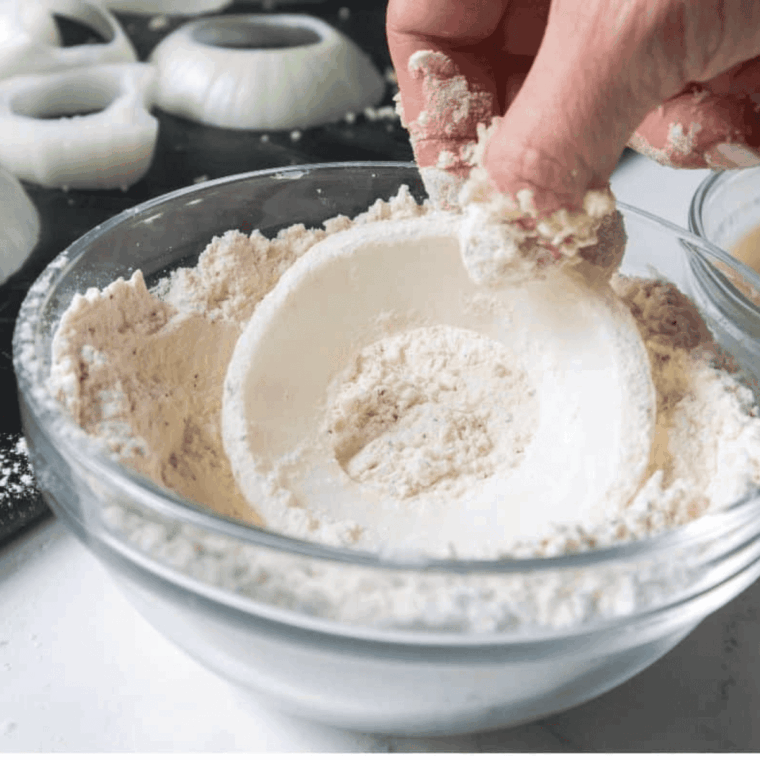 Coat the onion rings with batter and then the panko breadcrumbs.