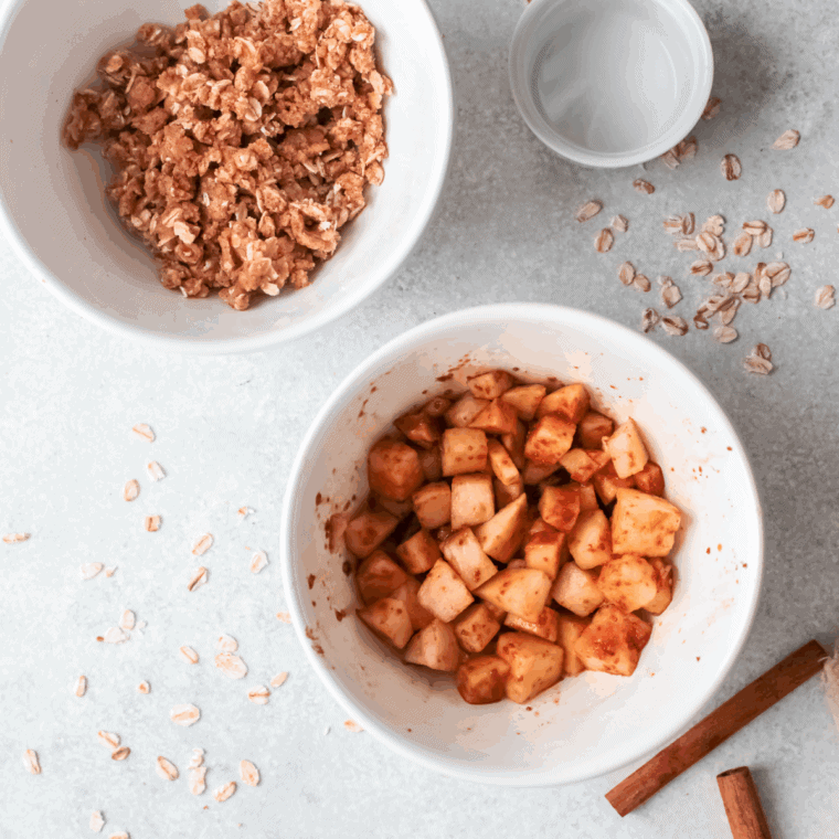 Apple crisp topping being sprinkled evenly over the apple filling before baking; the finished golden brown crisp is served warm with vanilla ice cream.
