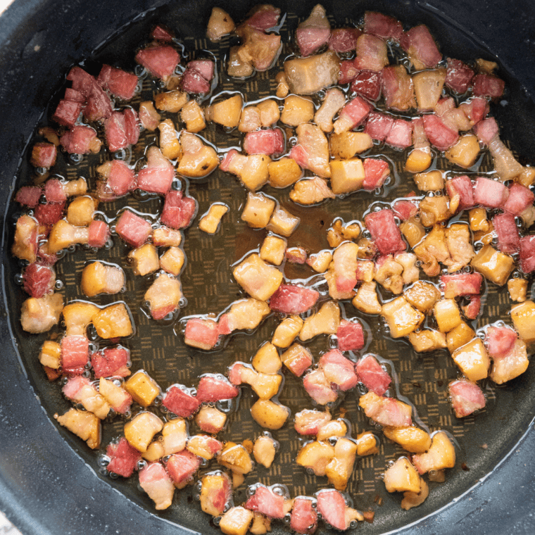 Diced pancetta saut&eacute;ing in an Instant Pot insert until crispy with rendered fat for carbonara