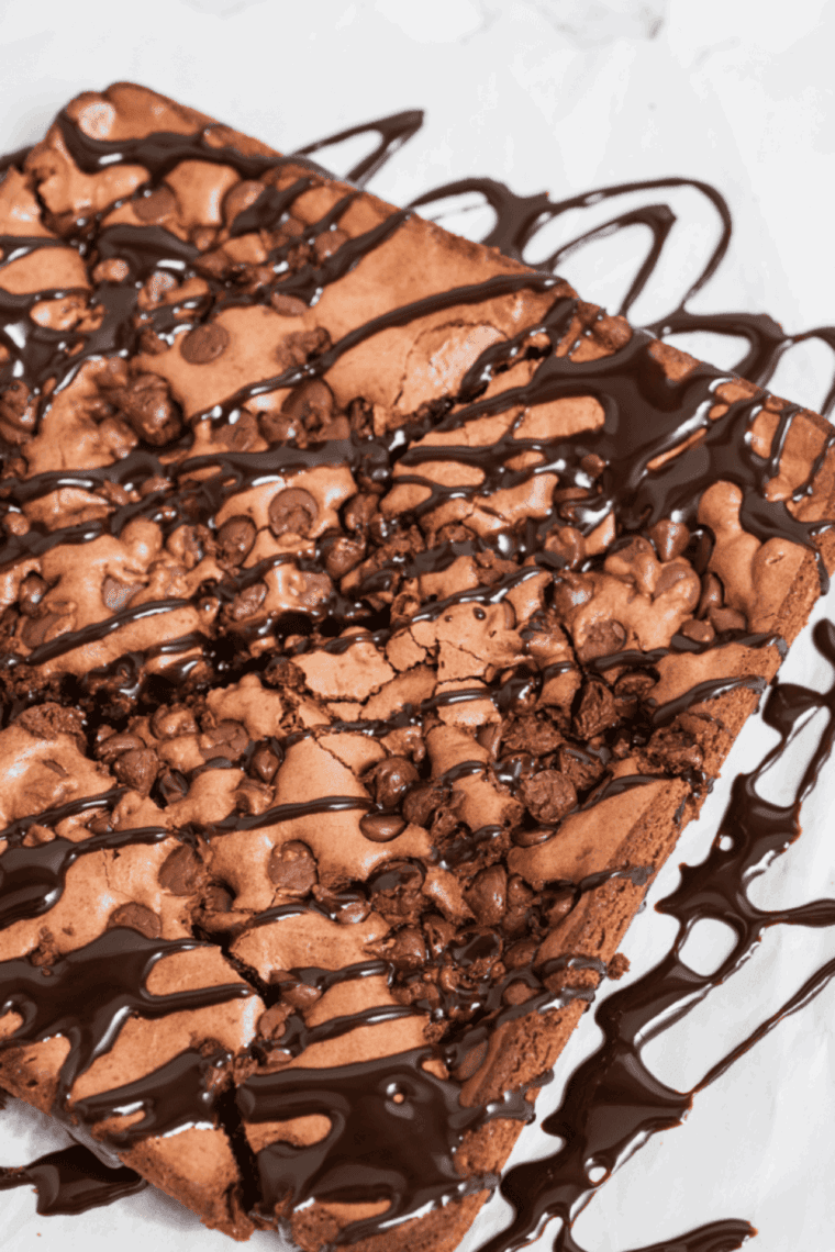 Plate of Golden Corral brownies with a fudgy center and crackly chocolate topping.