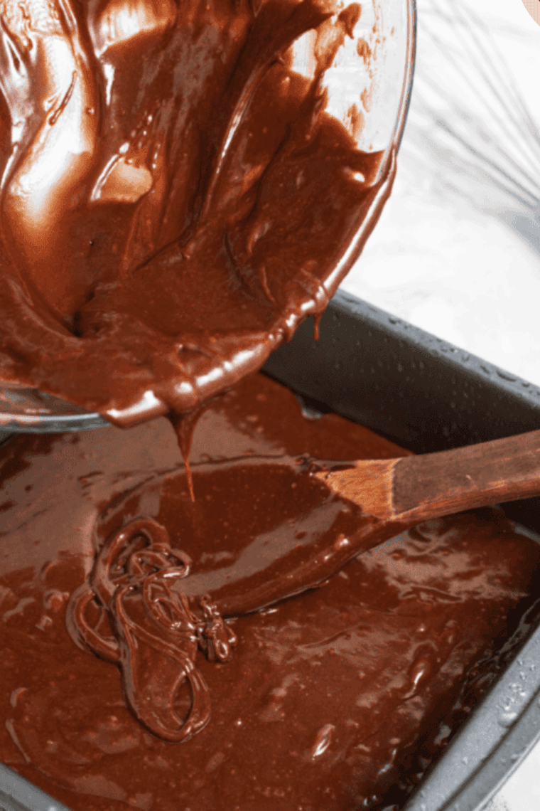 Mixing butter, sugar, eggs, and vanilla with dry ingredients for Golden Corral brownie batter.