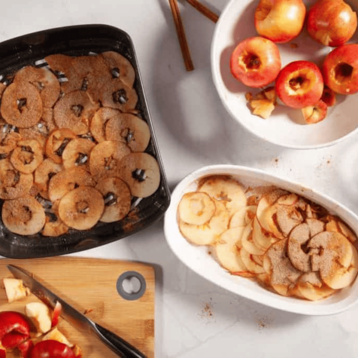 Apple slices arranged in a single layer in an air fryer basket, ready to crisp evenly.