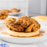 Air Fryer Chicken and Waffles-- There is nothing better for a quick dinner than this homemade Air Fyre chicken and waffles Recipe! Air Fried Buttermilk Fried Chicken is on top of a pile of fluffy waffles. What is better?