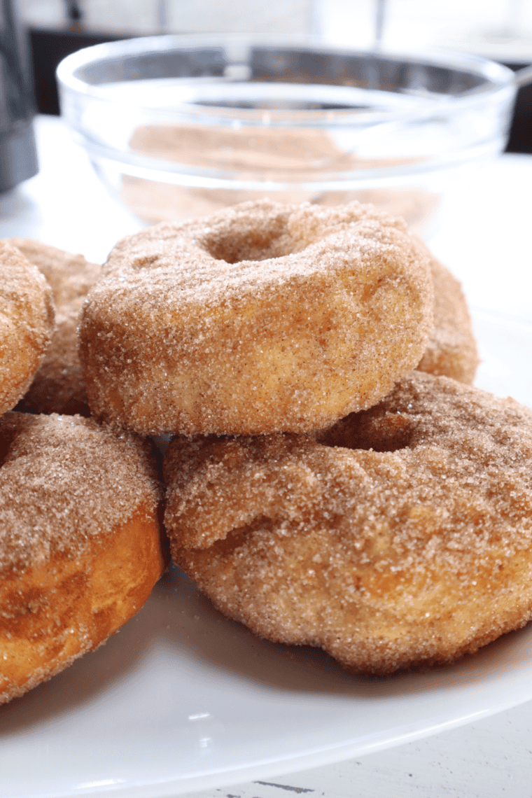 Air fryer cronuts with cinnamon sugar coating and a crispy, golden exterior.