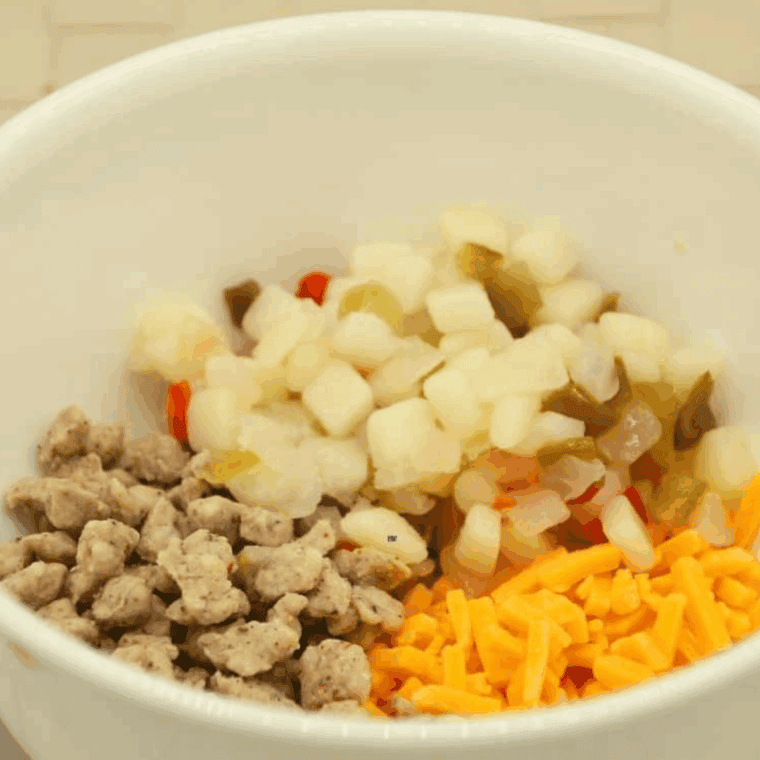 Ingredients needed for Air Fryer Egg Bites with Sausage on kitchen table.